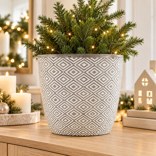 Grey and white Aztec planter in a warm festive home setting