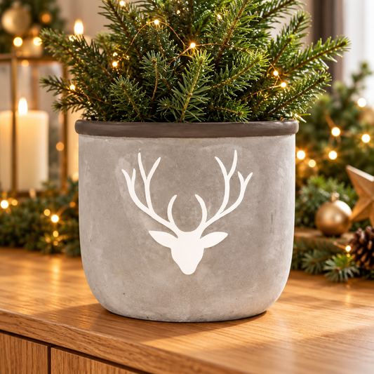 Grey cement stag planter in a warm festive home setting