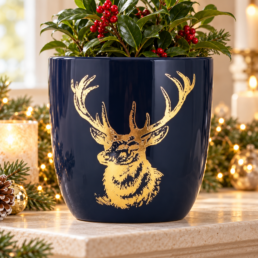 Blue and gold ceramic stag planter in a festive display
