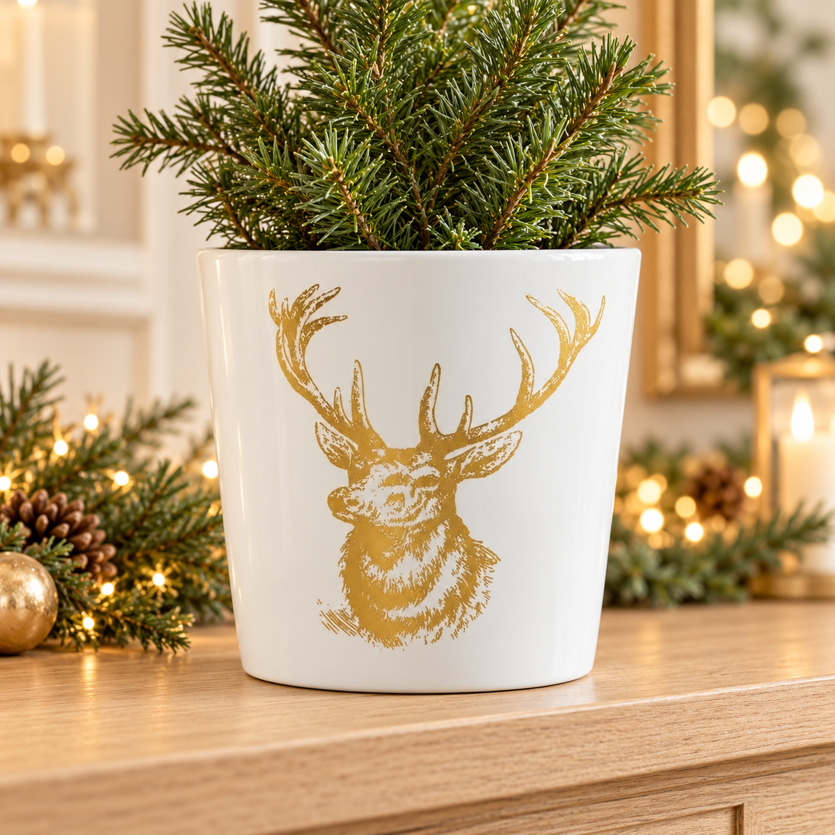 White ceramic gold stag planter in a warm festive home setting