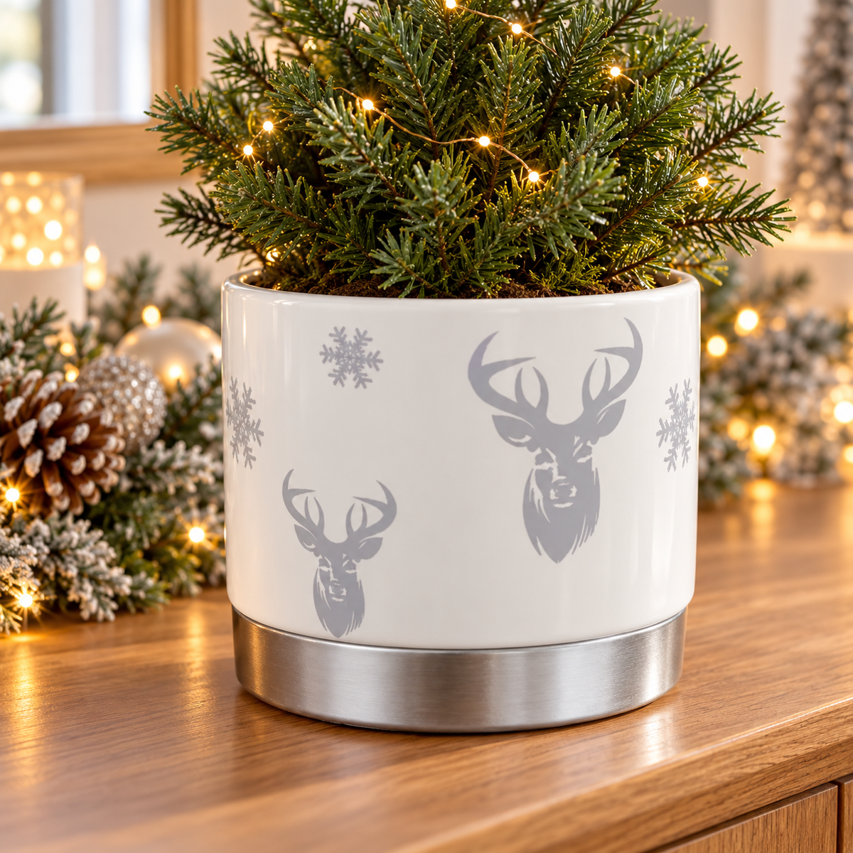 White ceramic silver stag planter in a warm festive home setting