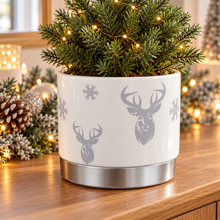 White ceramic silver stag planter in a warm festive home setting
