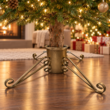 Large gold traditional 6-inch Christmas tree stand supporting a real tree