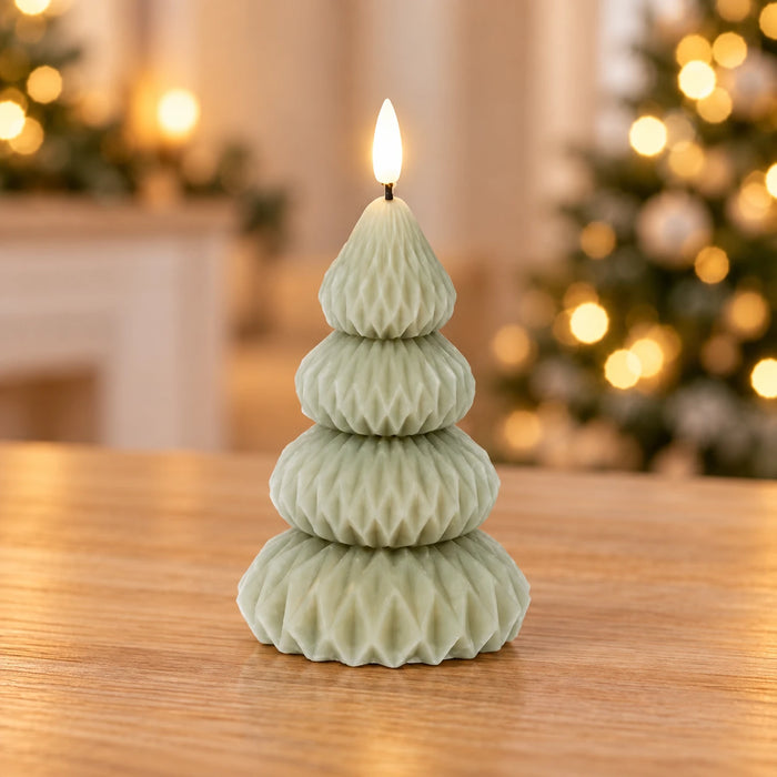 Green LED Wax Christmas Tree Candle – 13.5cm – full product in a festive home setting