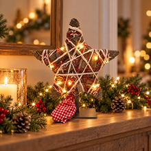 LED willow Christmas star ornament glowing on a festive mantel