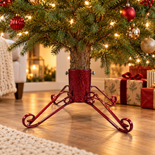 Red sparkle traditional 4-inch Christmas tree stand supporting a real tree