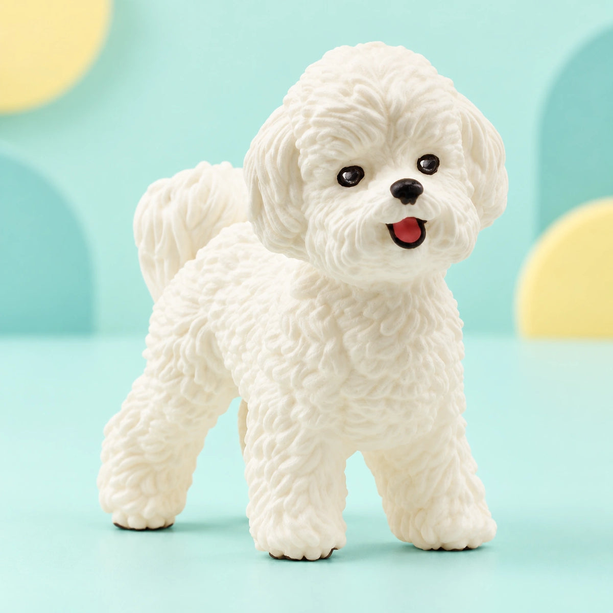 Schleich - Bichon Frise shown in full on a pale teal studio background