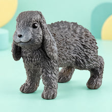 Schleich - Lop-Eared Rabbit shown in full on a pale teal studio background