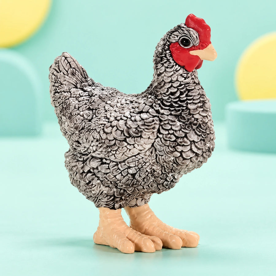Schleich - Plymouth Rock Chicken shown in full on a pale teal studio background